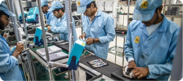 Technicians performing electronics assembly and packaging