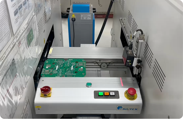 Benchtop test equipment running checks on populated circuit boards
