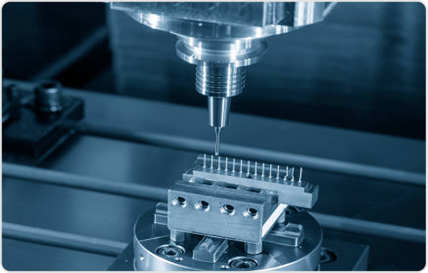 CNC machine head machining a metal component